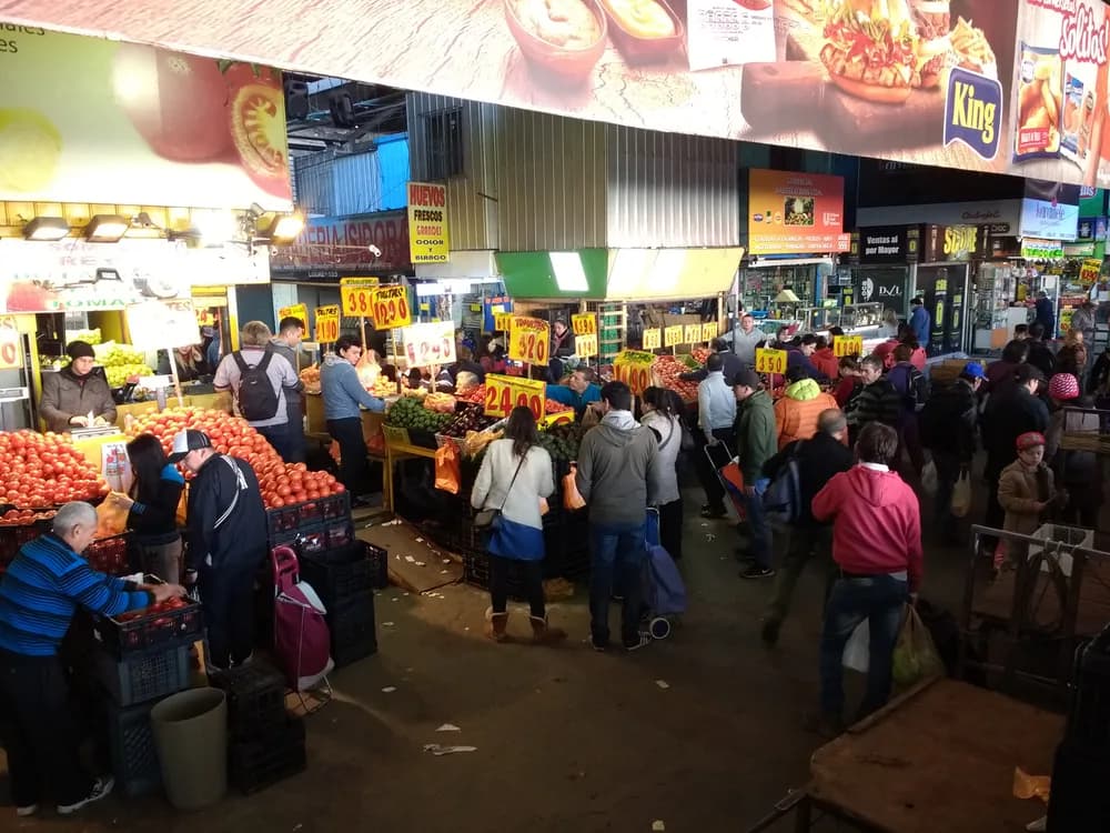 Produce stalls and shoppers at La Vega Central market in 2017