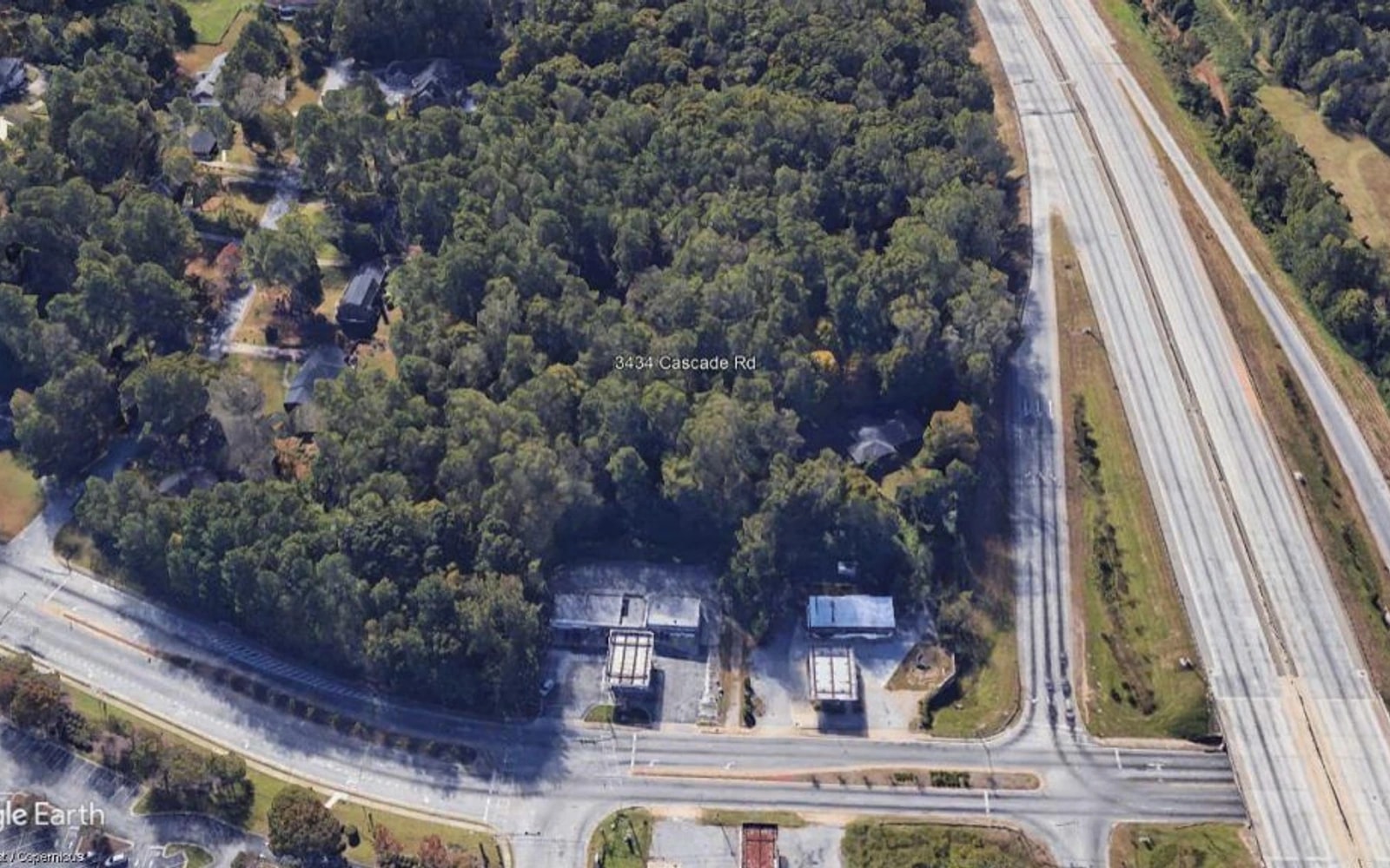 Google Earth Pro aerial image labeled 3434 Cascade Road, showing dense tree canopy, nearby roadside businesses, Cascade Road and I-285 in southwest Atlanta.